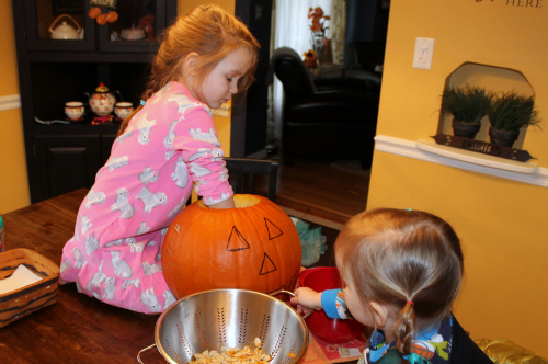 grace cleaning out pumpkin